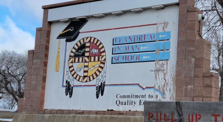 School sign outside.